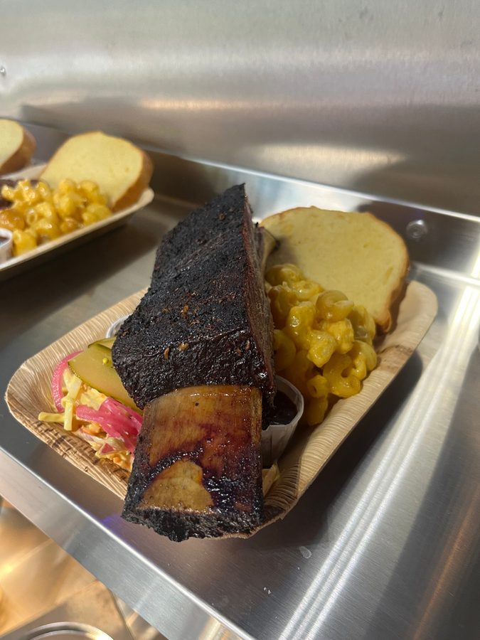 Sliced brisket with a dark bark in the serving tray