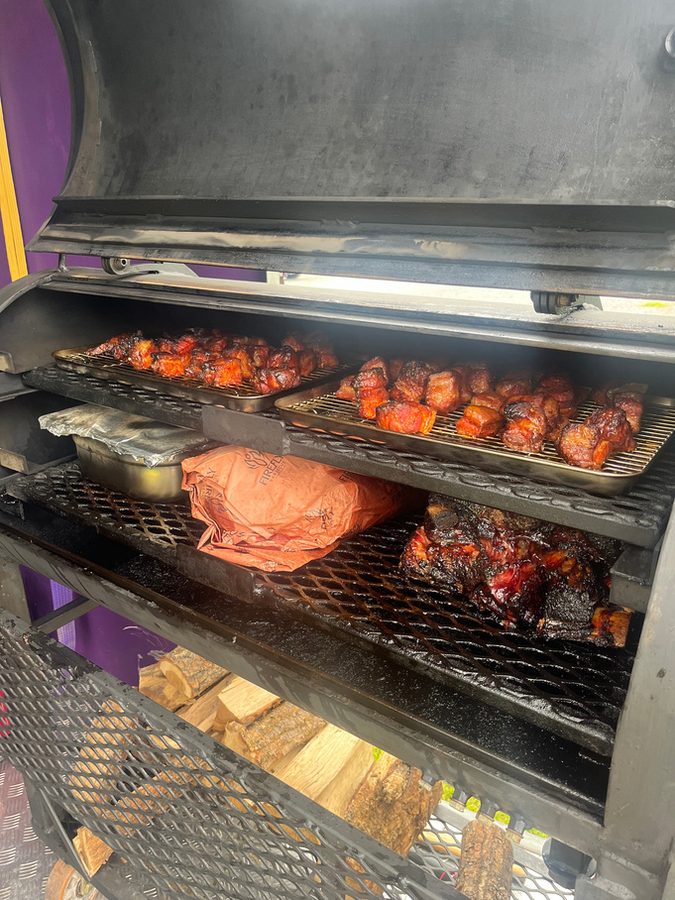 Chicken and ribs on the smoker racks